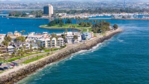 Stunning drone shot of San Diego's coastline, showcasing urban cityscape and ocean views.